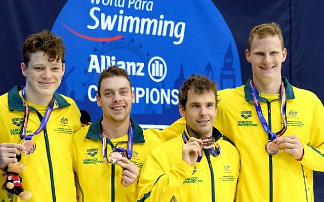 Australia’s Matthew Levy (second from right) receiving his bronze medal with teammates. Photo: Swimming Australia