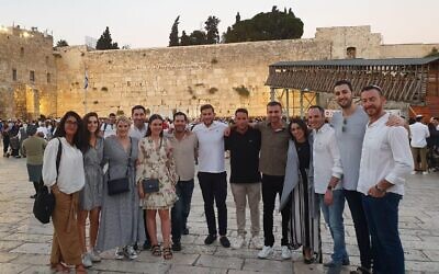 The mission participants visiting the Kotel.
