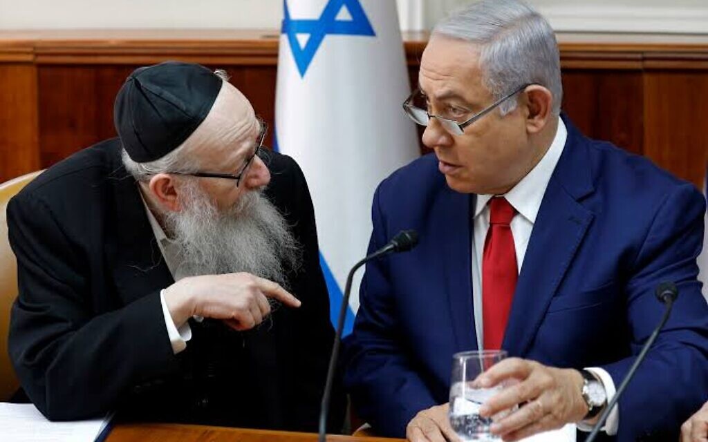 Benjamin Netanyahu, right, listens to Yaakov Litzman at the start of the the weekly cabinet meeting earlier this year in  the prime minister's office in Jerusalem.