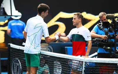 Novak Djokovic (left) shakes hands with Diego Schwartzman after the match. Photo: Peter Haskin