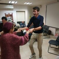Adam Marks dancing at a party in Israel for Holocaust survivors in December.