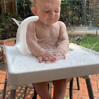 Yael Rothschild entered this photo of Issac Richardson cooling off on a hot day.