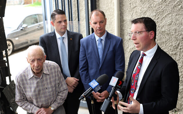Anti-Defamation Commission chair Dvir Abramovich (right) speaking at a press conference earlier this month, flanked by (from left) Shoah survivor Joe de Haan, Brighton MP James Newbury and Caulfield MP David Southwick. Photo: Peter Haskin