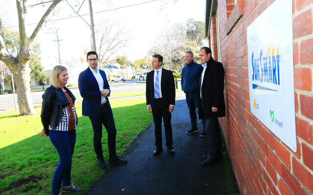 Josh Burns (second from left), Dvir Abramovich and Martin Foley with
representatives from Middle Park Kindergarten on Tuesday. Photo: Peter Haskin