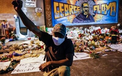 A protester at a memorial for George Floyd where he died outside Cup Foods in Minneapolis.
Photo: AP Photo/John Minchillo