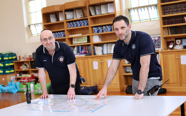 Leon Landau (left) of Hatzolah and Justin Kagan of CSG, at Hatzolah headquarters this week. Photo: Peter Haskin