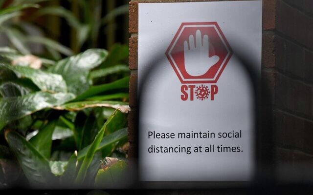 A COVID-19 warning sign at Rose Bay Public School last month.
Photo: AAP Image