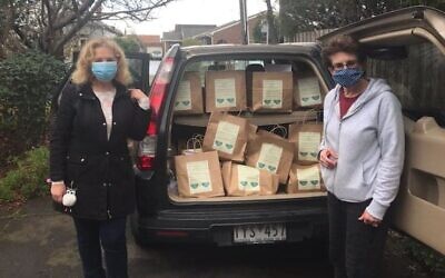 Ellen Frajman (right) with Mazon’s soup share bags.