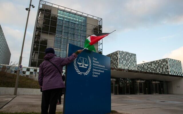A demonstrator with a Palestinian flag outside the International Criminal Court in November 2019.
Photo: AP photo/Peter Dejong