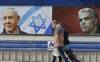 A billboard showing a portrait of Prime Minister Benjamin
Netanyahu (left) and opposition party leader Yair Lapid. Photo: Jack Guez/AFP