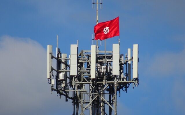 A Nazi flag attached to a phone tower in the the Victorian town of Kyabram last April.
Photo: Twitter