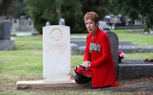 Sergeant Julie Leder, representative of VAJEX at the gravestone of James
Drummond, who was in fact Jacob Sorsky. Photo: Peter Haskin