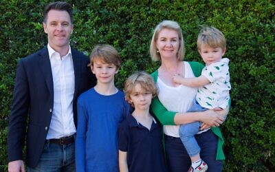 Chris Minns (left) with wife Anna and their children. Photo: Supplied
