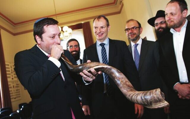 Matthew Guy blows the shofar during a meeting with members of the Rabbinical Council of Victoria in the lead up to Rosh Hashanah in 2015. 
Photo: Peter Haskin