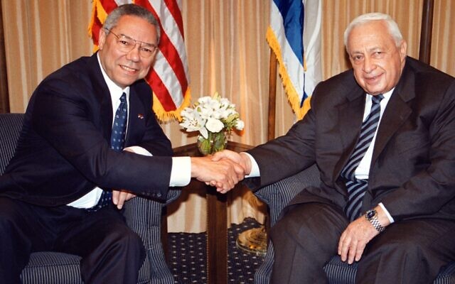 US Secretary of State Colin Powell, left, shakes hands with Israeli Prime Minister-elect Ariel Sharon in Jerusalem on February 25, 2001. Photo: Getty Images