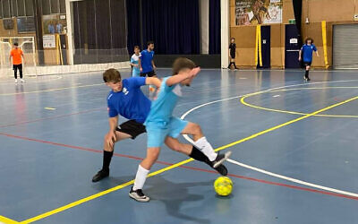 Action from the futsal round one men's youth game in Sydney on October 30 between Hakoah and Quake.