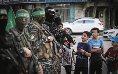 Palestinian boys line up to register for a summer camp organised by Hamas earlier this year. Photo: Mahmud Hams/AFP