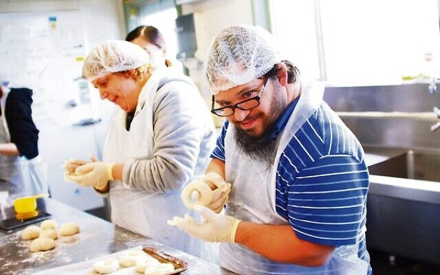 Plain or poppy seed? Sharon Breuer and David Ekman hard at work making bagels at the Access Inc bakery.