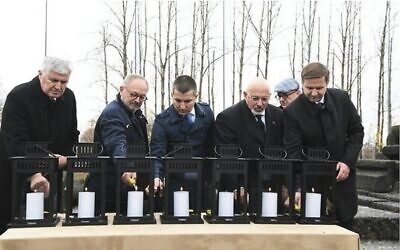 European lawmakers lighting candles at Auschwitz. 
Photo: Yossi Zeliger/EJA