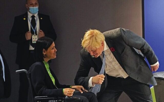 Boris Johnson (right) greets Karine Elharrar at COP26 in Glasgow on Tuesday. 
Photo: Alberto Pezzali /AFP)