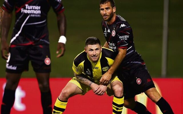 Tomer Hemed (on right) in action for the Wanderers against his old team, Wellington Phoenix. Photo: Mark Kolbe/Getty Images