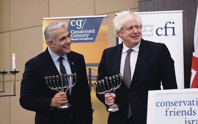 Yair Lapid (left) and Boris Johnson in London on Monday. Photo: Stuart Mitchell