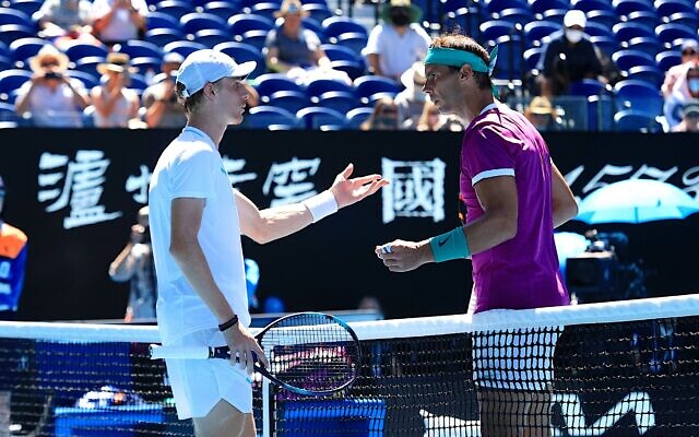 Denis Shapovalov (left) and Rafael Nadal having a mid-match netside chat to try to resolve a disputed issue during their quarter-final match on January 25 in Rod Laver Arena. Photo: Peter Haskin