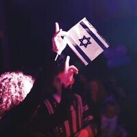 Proudly waving the Israeli flag at Yom Ha'atzmaut celebrations at Caulfield Racecource. Proudly waving the Israeli flag at Yom Ha'atzmaut celebrations at Caulfield Racecource.