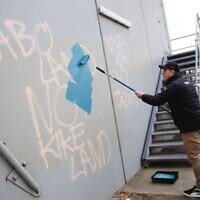 AJAX football club president Ronnie Lewis paints over Anti semetic graffiti on the side of the David Mandie pavillion at Gary Smorgon Oval, Albert Park. AJAX football club president Ronnie Lewis paints over Anti semetic graffiti on the side of the David Mandie pavillion at Gary Smorgon Oval, Albert Park.