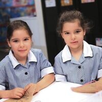 Identical twins Chloe (left) and Romy Unger at Mount Scopus Memorial College. Photo: Peter Haskin