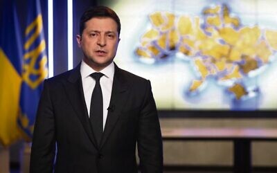 In this handout photo taken from a video provided by the Ukrainian Presidential Press Office, Ukrainian President Volodymyr Zelensky addresses the nation in Kyiv on February 24. Zelensky declared martial law, saying Russia has targeted Ukraine's military infrastructure. He urged Ukrainians to stay at home and not to panic. Photo: Ukrainian Presidential Press Office via AP