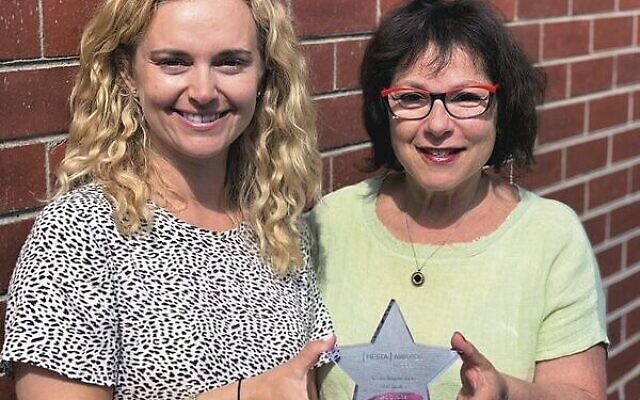 Caring Mums coordinator Robyn Davis and programs manager Michelle Kornberg with their Hesta finalists trophy.