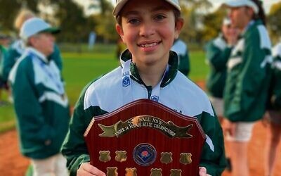 Carla Joffee holding the 2021 NSW U14 girls' softball shield. She has been selected to represent NSW at next month's nationals.