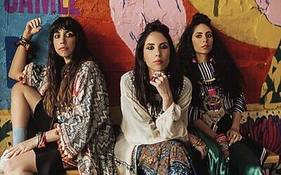 The cover of The Flying Camel features A-WA, an Israeli band made up of the three sisters Tair, Liron, and Tagel Haim. Photo: Rotem Lebel.