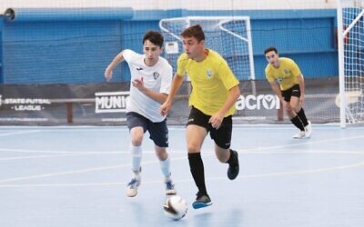 Ethan De Melo (front, on right) has been selected in the Futsalroos squad for the second time. Photo: Peter Haskin