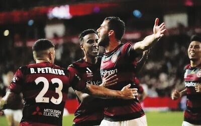Tomer Hemed celebrates with his Wanderers teammates after their 2-0 win over Sydney FC last Saturday at Commbank Stadium. Photo: Western Sydney Wanderers