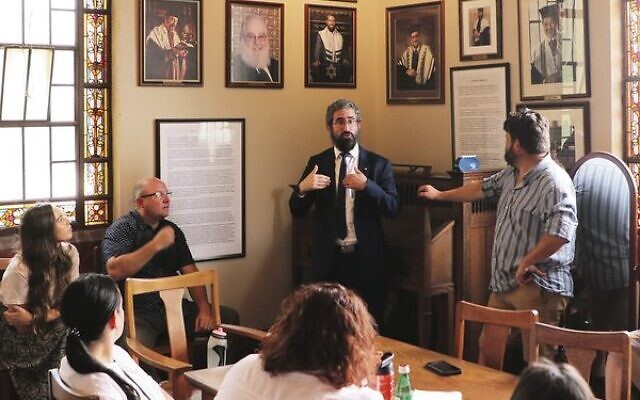 Rabbi Glasman talking with the team. Photo: Will McEniry