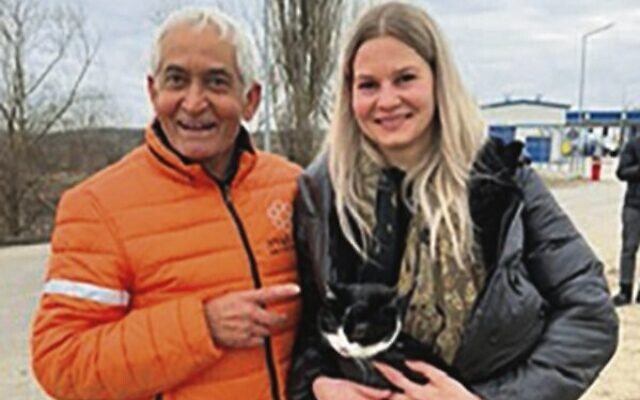 Ben Raymond helps a Ukrainian refugee and her cat.