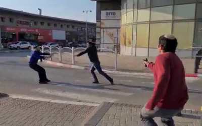 A suspected assailant being shot in Beersheba on March 22, 2022. Photo: Twitter Screenshot