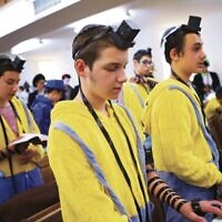 Minions in a minyan at Yeshivah College.  Photo: Peter Haskin