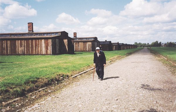 Henry walking in Field A at Auschwitz-Birkenau during a visit in 2001.