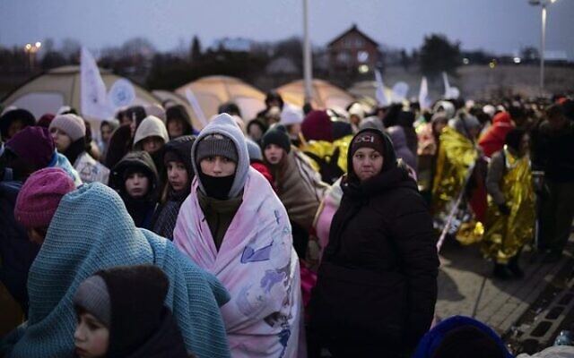 Ukrainian refugees at the border crossing in Medyka, Poland. 
Photo: AP Photo/Markus Schreiber