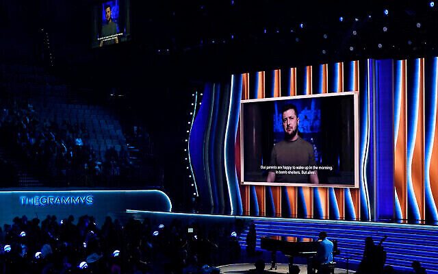President of Ukraine, Volodymyr Zelenskyy, speaks on screen at the 64th Annual Grammy Awards. AP Photo/Chris Pizzello