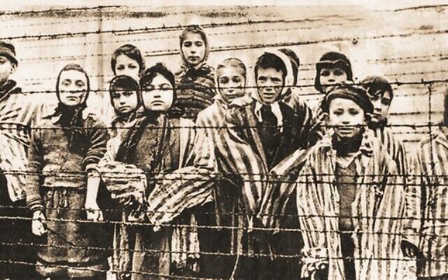 Survivors moments after the Red Army liberated Auschwitz on January 27, 1945. Melbourne survivor Eva Slonim, then 13 years old, is pictured centre front.