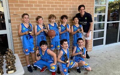The Maccabi U10 Clippers players with their trophies last Sunday.