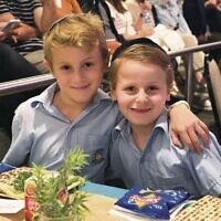 Raphy (left) and Zev Bass at Masada's demo seder table.