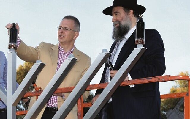 Bradfield MP Paul Fletcher (left) at the 2017 Chanukah on the Green event in St Ives, alongside Rabbi Nochum Schapiro. Photo: Noel Kessel.