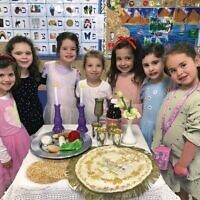 Preparing the seder plate at the Gurewicz Early Learning Centre.