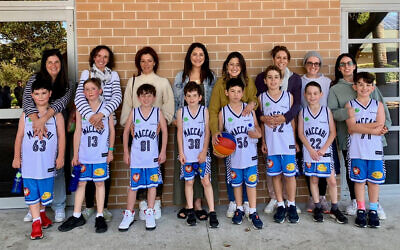 Maccabi NSW U12 Clippers players with their mums before their Easts Basketball League match on May 8.