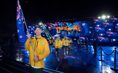 Sean Bloch carries the Australian flag at the 2017 Maccabiah Games opening ceremony. Photo: Julie Kerbel